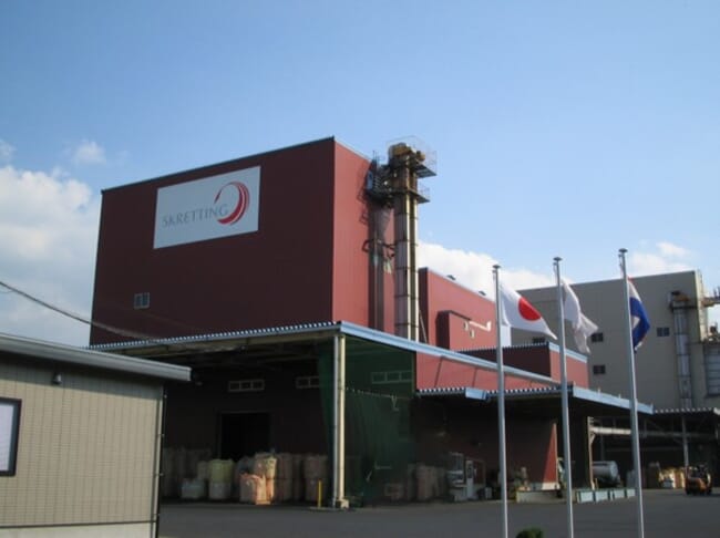A aquaculture feed mill in Japan on a sunny day.