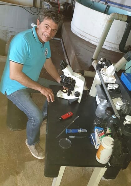 person working with a microscope